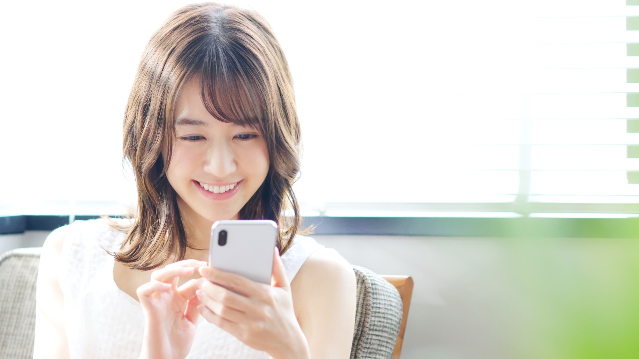 Woman enjoying new content and brand content from LINE advertising in Japan