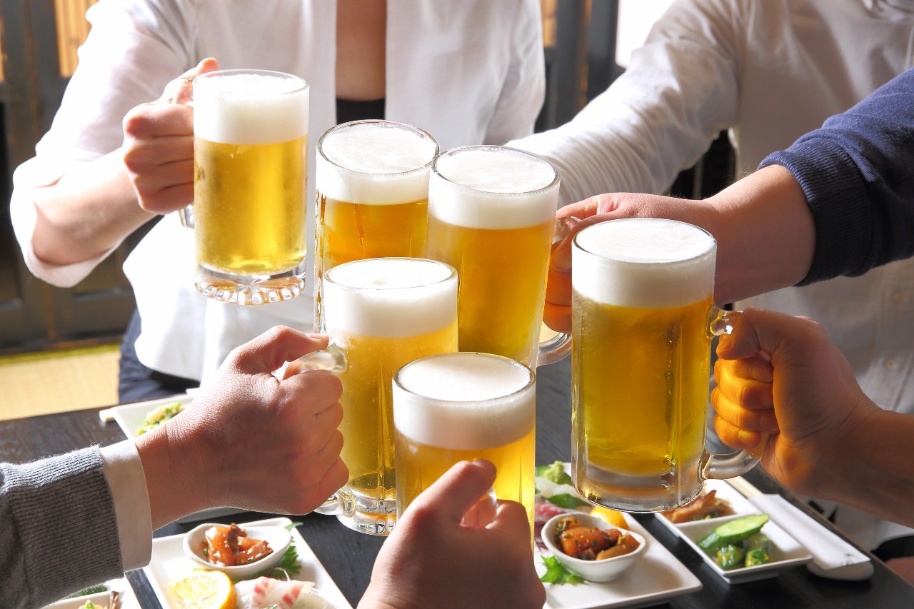 Colleagues socialising with beer as part of Japanese business culture