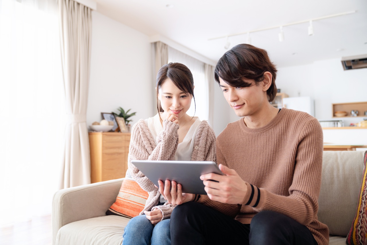 Couple enjoying online content localized by translation services in Japan