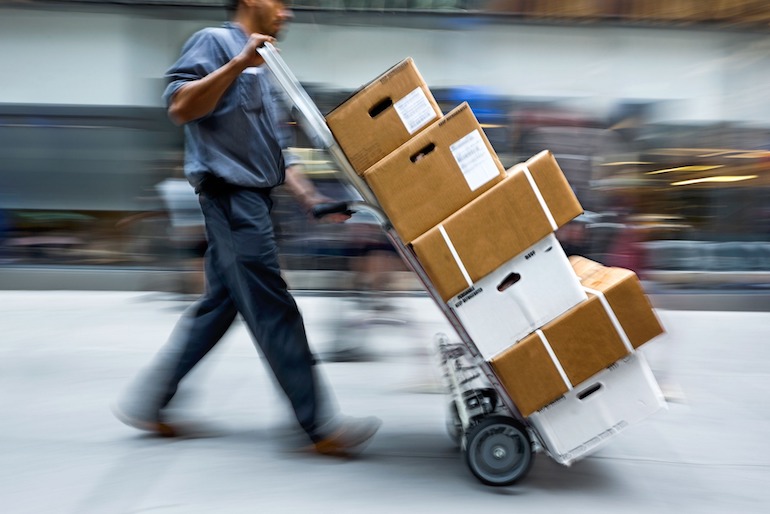 Courier delivering package for merchants who sell on Amazon Japan