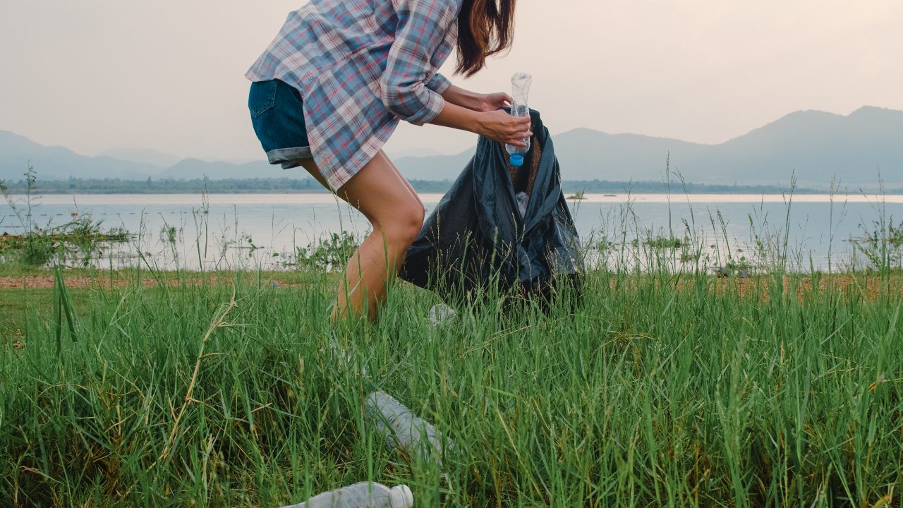 Employee collecting waste plastic to represent initiative for CSR in Japan
