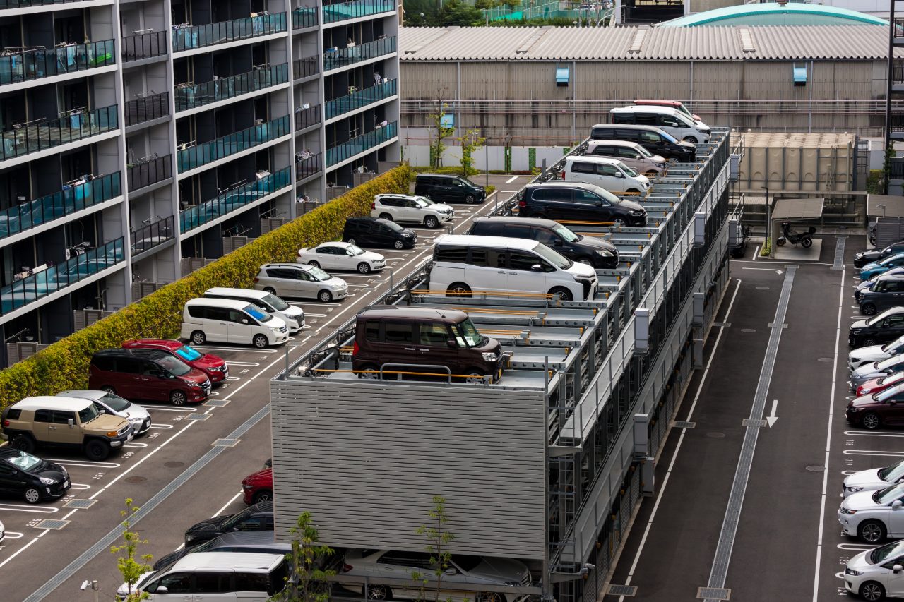 Japanese car park featuring compact cars not American brands in Japan