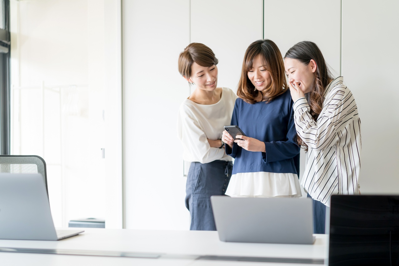 Japanese colleagues enjoying localized digital marketing in Japan
