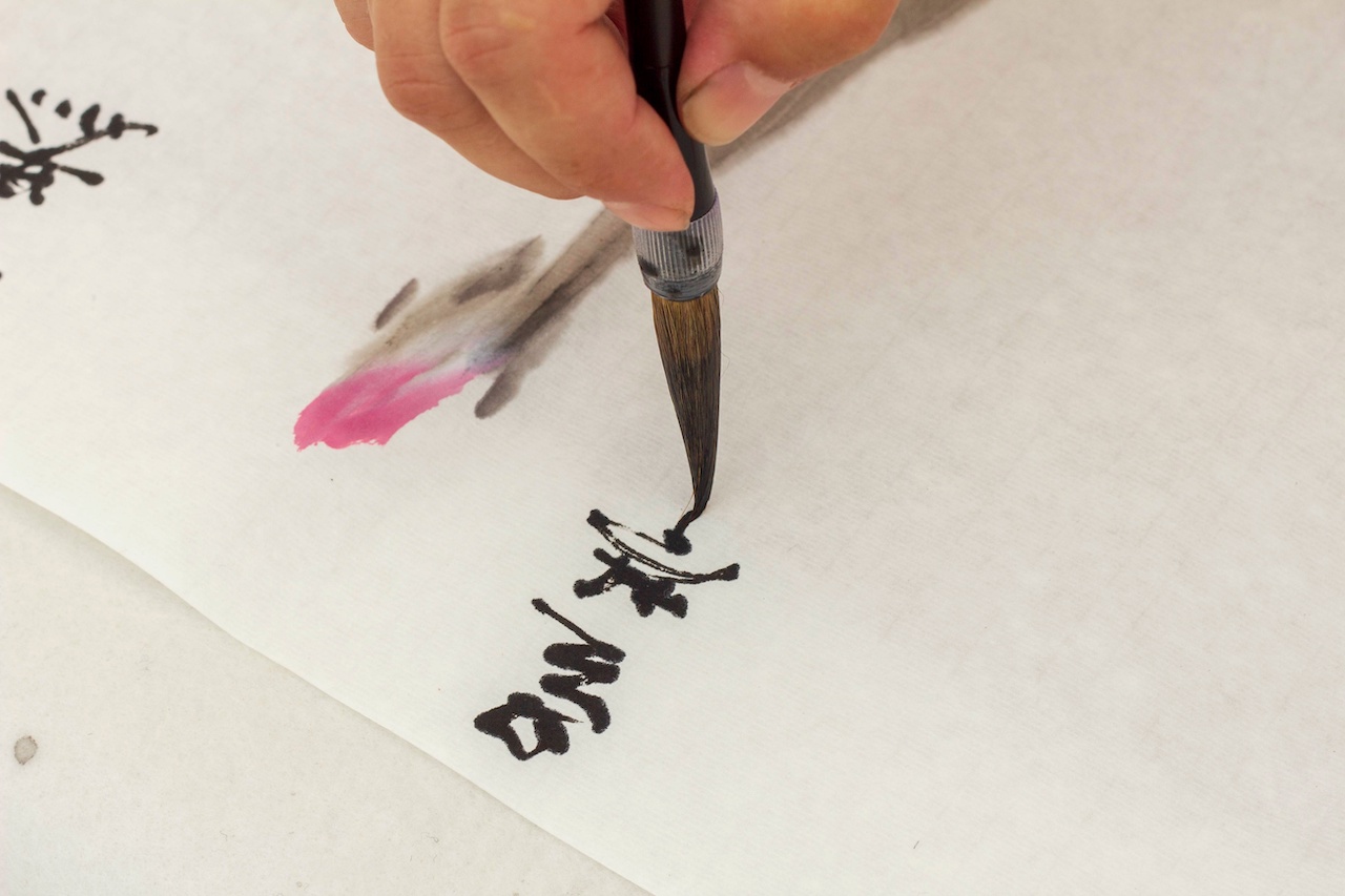 Man using calligraphy in Japanese creative design
