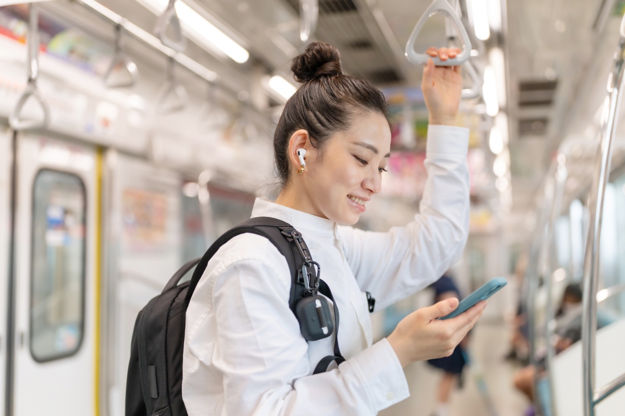 Millennial consuming content from Japan SEM on Tokyo train