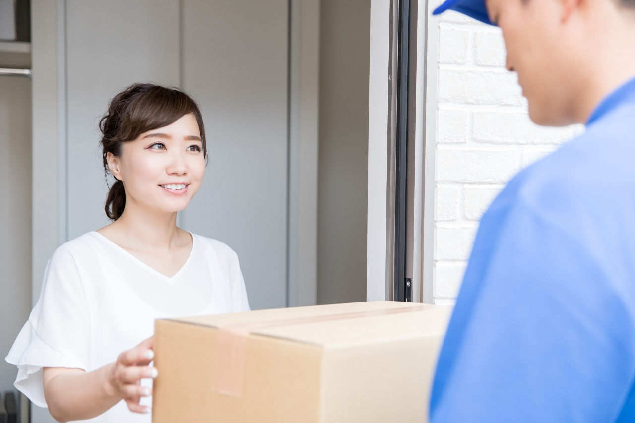 Shopper receiving delivery from courier and amazon seller in Japan